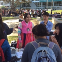 Students around a table at the fair